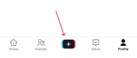 TikTok main screen showing the plus button highlighted, where users tap to start creating or going live on the app.
