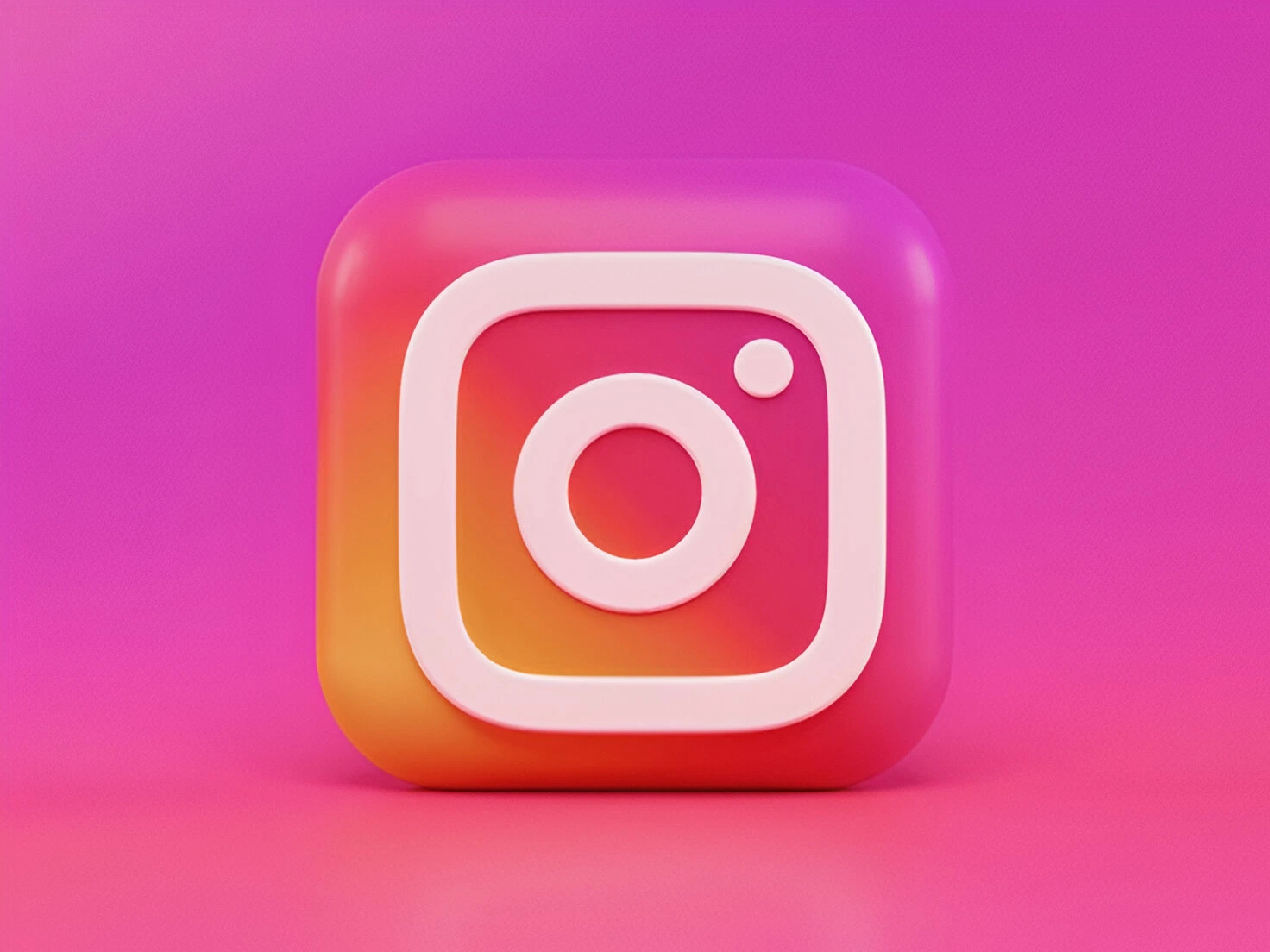 Vibrant pink and purple Instagram icon on a coordinated pink and purple background, enhancing its social media appeal.